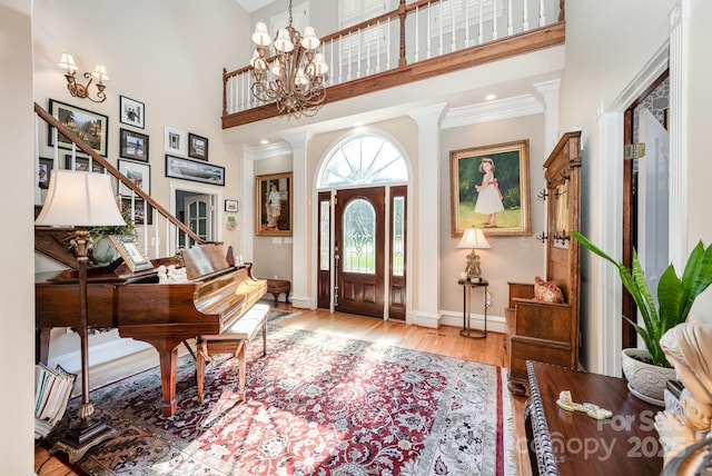 408 Johnsfield Rd, Shelby, NC 28150 - foyer entrance with a high ceiling, wood finished floors, a chandelier, and ornamental molding