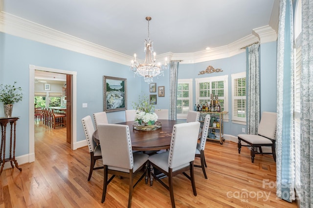 408 Johnsfield Rd, Shelby, NC 28150 - dining space featuring a chandelier, crown molding, and light wood-type flooring
