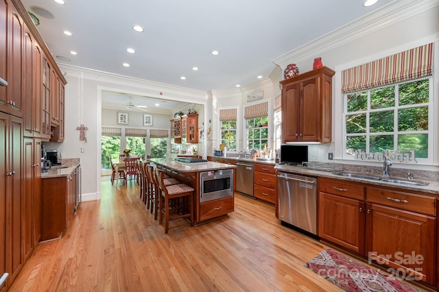 408 Johnsfield Rd, Shelby, NC 28150 - kitchen featuring appliances with stainless steel finishes, plenty of natural light, ornamental molding, light stone countertops, and recessed lighting