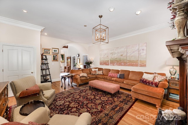 408 Johnsfield Rd, Shelby, NC 28150 - living room with arched walkways, wood finished floors, ornamental molding, recessed lighting, and a chandelier