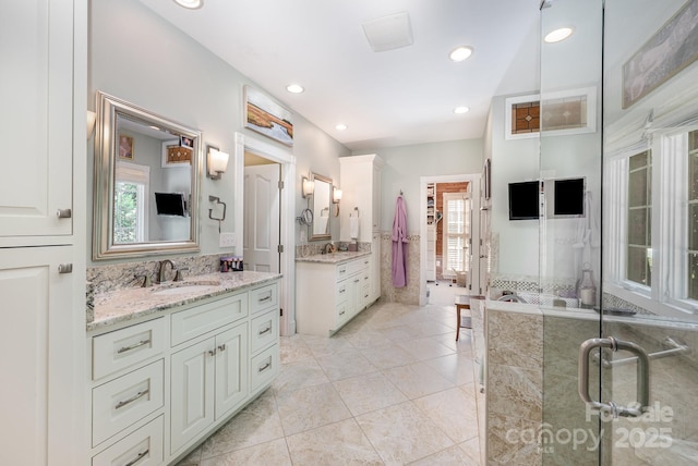 408 Johnsfield Rd, Shelby, NC 28150 - bathroom featuring two vanities, tile patterned flooring, and recessed lighting