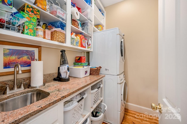 408 Johnsfield Rd, Shelby, NC 28150 - laundry room featuring stacked washer / drying machine and light wood finished floors