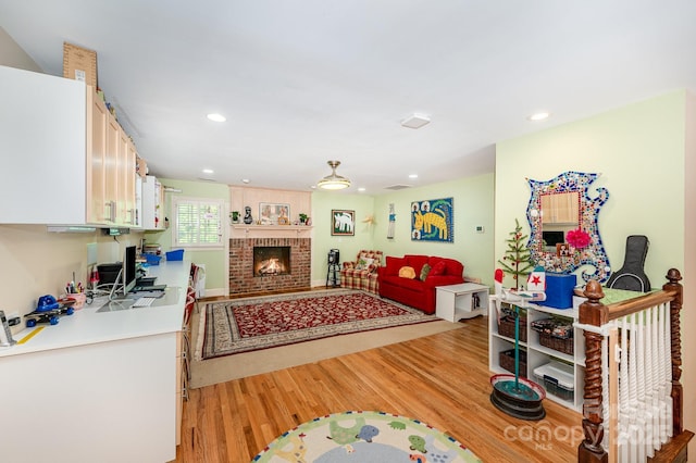 408 Johnsfield Rd, Shelby, NC 28150 - living area with light wood-style floors, recessed lighting, and a fireplace