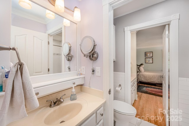 408 Johnsfield Rd, Shelby, NC 28150 - bathroom with ornamental molding, vanity, ensuite bath, wainscoting, and tile walls