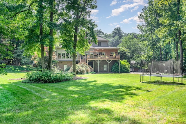 408 Johnsfield Rd, Shelby, NC 28150 - view of green lawn featuring a trampoline, a deck, and stairs