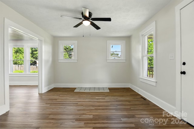 3923 US Highway 321a, Hudson, NC 28638 - unfurnished room with baseboards, ceiling fan, wood finished floors, and a textured ceiling