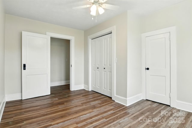 3923 US Highway 321a, Hudson, NC 28638 - unfurnished bedroom featuring wood finished floors, a closet, baseboards, and ceiling fan