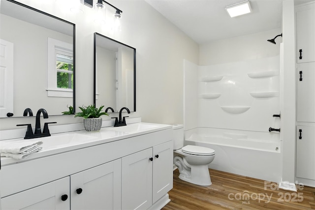 3923 US Highway 321a, Hudson, NC 28638 - full bath with toilet, double vanity, wood finished floors, and bathtub / shower combination