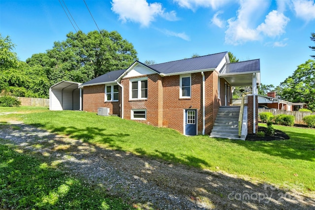 3923 US Highway 321a, Hudson, NC 28638 - view of side of property featuring a carport, brick siding, cooling unit, metal roof, and driveway