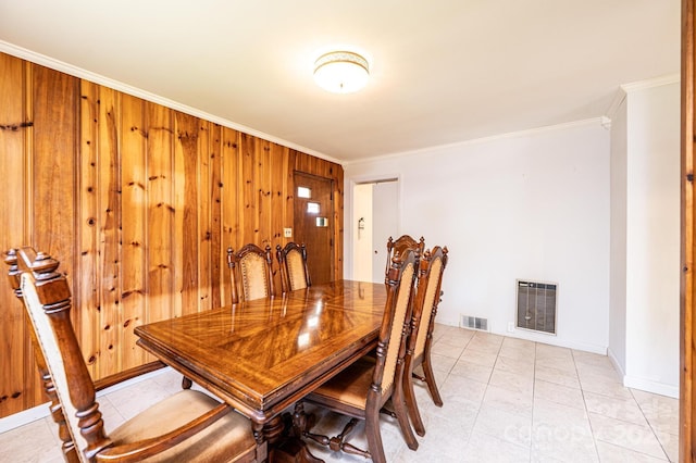 4783 Calico Rd, Lenoir, NC 28645 - dining area with crown molding, light tile patterned flooring, baseboards, and wood walls