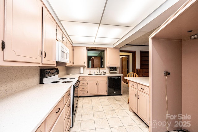 4783 Calico Rd, Lenoir, NC 28645 - kitchen with range with electric stovetop, black dishwasher, a sink, white microwave, and light countertops