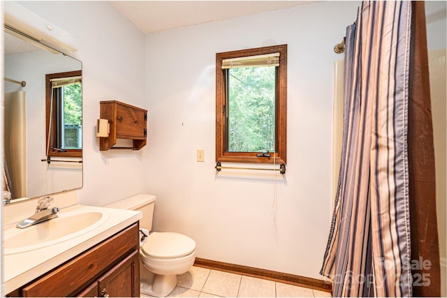 4783 Calico Rd, Lenoir, NC 28645 - full bath featuring healthy amount of natural light, vanity, tile patterned flooring, and a shower with curtain