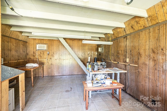 4783 Calico Rd, Lenoir, NC 28645 - basement with wooden walls, tile patterned floors, and a wall mounted air conditioner