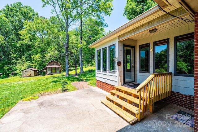 4783 Calico Rd, Lenoir, NC 28645 - doorway to property featuring a patio area and a lawn