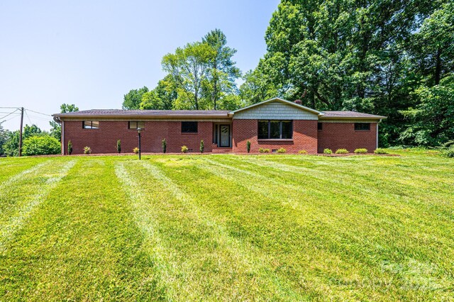4783 Calico Rd, Lenoir, NC 28645 - back of house with a lawn and brick siding