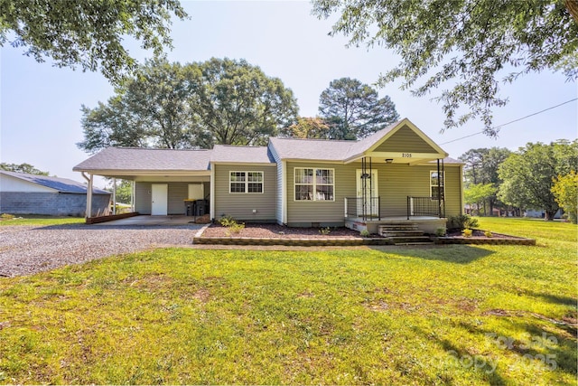 2105 Florida Ave, Kannapolis, NC 28083 - view of front of house with gravel driveway, a porch, an attached carport, and a front yard