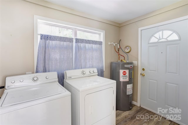 2105 Florida Ave, Kannapolis, NC 28083 - laundry room with electric water heater, independent washer and dryer, wood finished floors, and baseboards