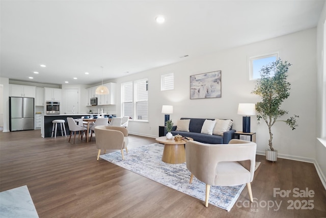 16112 Langston Dr, Charlotte, NC 28278 - living room with dark wood finished floors and recessed lighting