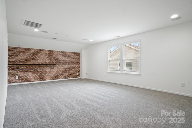 16112 Langston Dr, Charlotte, NC 28278 - spare room featuring brick wall, carpet flooring, and recessed lighting
