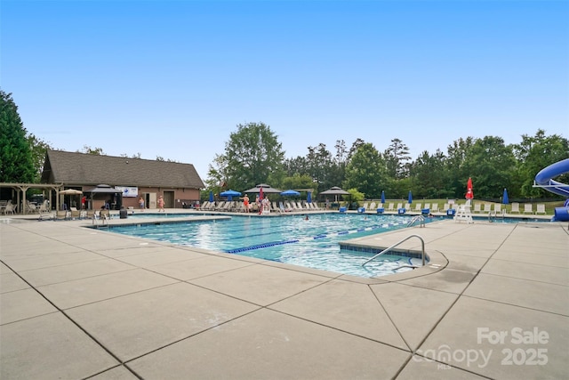 16112 Langston Dr, Charlotte, NC 28278 - community pool with a patio area and a water slide