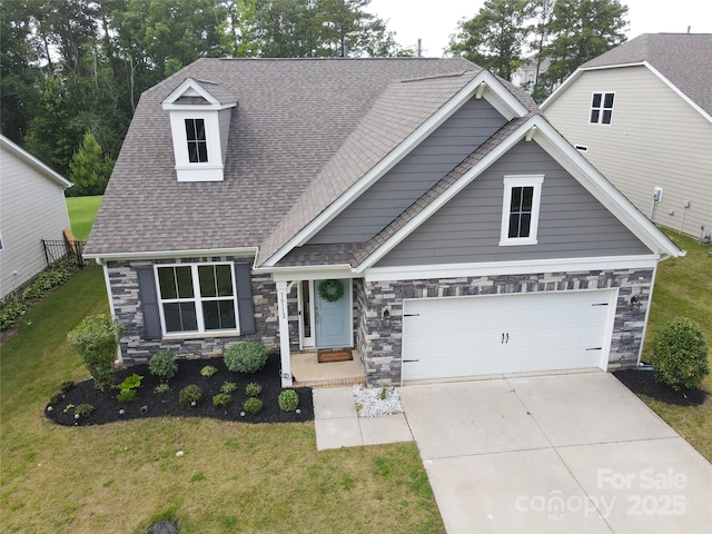 16112 Langston Dr, Charlotte, NC 28278 - craftsman-style house featuring stone siding, driveway, a front lawn, a shingled roof, and an attached garage
