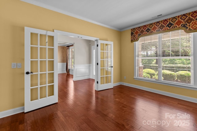126 Northbridge Dr, Mooresville, NC 28115 - empty room featuring ornamental molding, french doors, wood finished floors, and wainscoting
