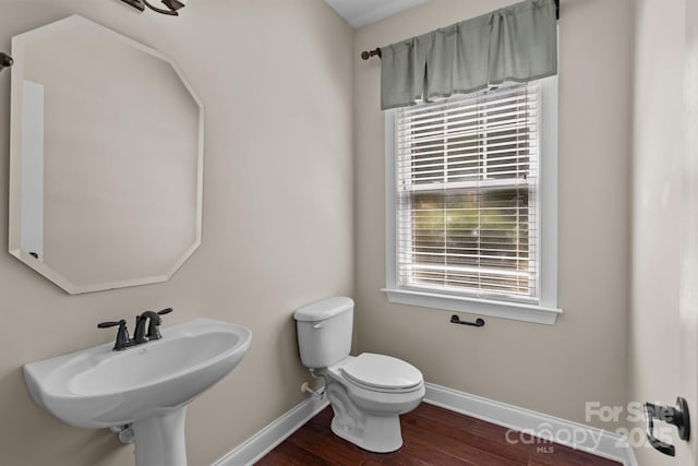 126 Northbridge Dr, Mooresville, NC 28115 - bathroom featuring baseboards, toilet, wood finished floors, and a sink