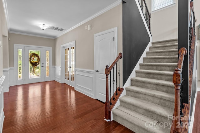 126 Northbridge Dr, Mooresville, NC 28115 - entrance foyer with stairs, wood finished floors, a wainscoted wall, and ornamental molding