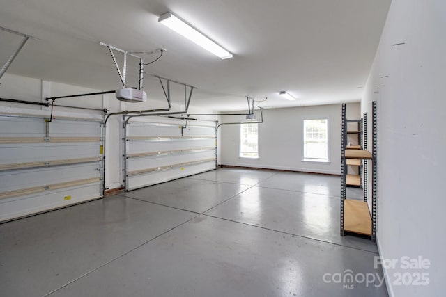 126 Northbridge Dr, Mooresville, NC 28115 - garage featuring a garage door opener and baseboards