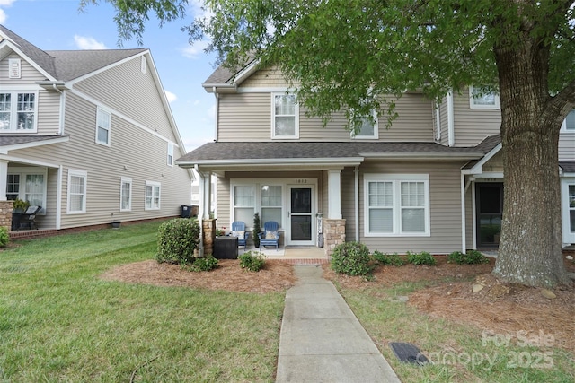 1012 Laparc Ln, Indian Trail, NC 28079 - view of front of property with a front lawn and a shingled roof