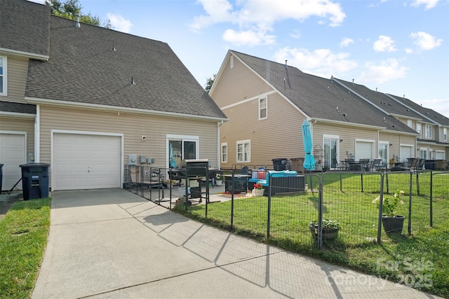 1012 Laparc Ln, Indian Trail, NC 28079 - rear view of property featuring concrete driveway and roof with shingles