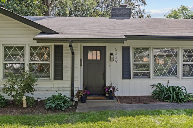 5329 Valley Forge Rd, Charlotte, NC 28210 - property entrance with a shingled roof and a chimney