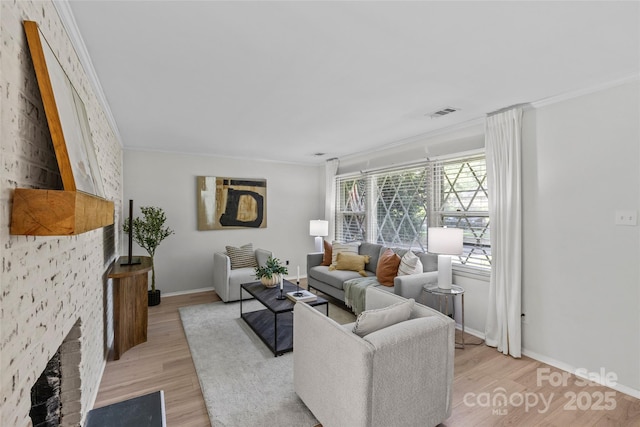 5329 Valley Forge Rd, Charlotte, NC 28210 - living room featuring light wood finished floors, ornamental molding, and a fireplace