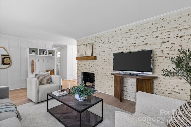5329 Valley Forge Rd, Charlotte, NC 28210 - living area with wood finished floors, crown molding, and a fireplace