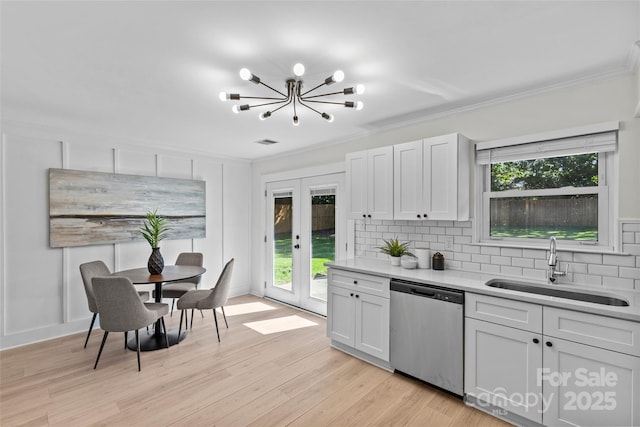 5329 Valley Forge Rd, Charlotte, NC 28210 - kitchen with dishwasher, french doors, crown molding, tasteful backsplash, and light countertops