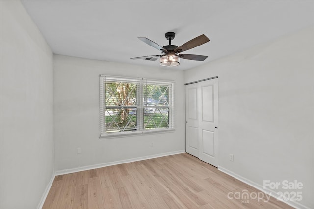 5329 Valley Forge Rd, Charlotte, NC 28210 - unfurnished bedroom featuring light wood-style flooring, a ceiling fan, and a closet