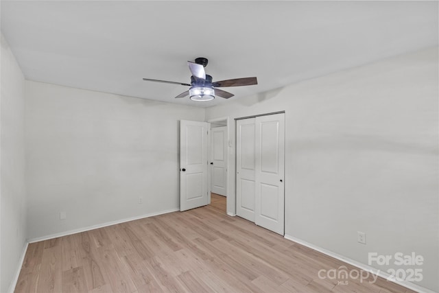 5329 Valley Forge Rd, Charlotte, NC 28210 - unfurnished bedroom with light wood-type flooring, a closet, and a ceiling fan