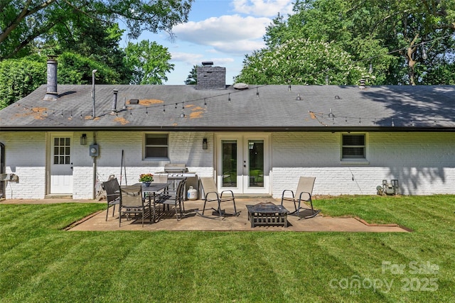 5329 Valley Forge Rd, Charlotte, NC 28210 - back of house with french doors, brick siding, a chimney, an outdoor fire pit, and a patio area