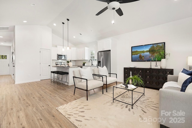 4230 Acorn St, Charlotte, NC 28205 - living room featuring light wood finished floors, a ceiling fan, high vaulted ceiling, and recessed lighting