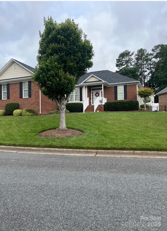 2300 Wednesbury Ct, Kannapolis, NC 28083 - ranch-style house featuring brick siding and a front lawn