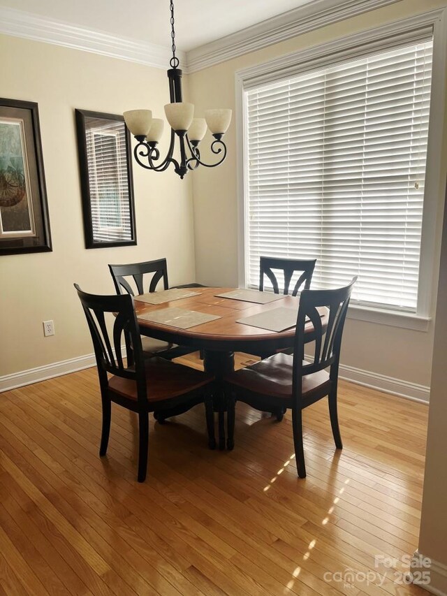 2300 Wednesbury Ct, Kannapolis, NC 28083 - dining space featuring a chandelier, light wood-style flooring, and ornamental molding