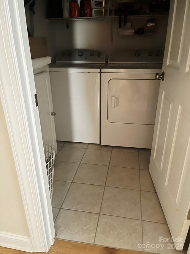 2300 Wednesbury Ct, Kannapolis, NC 28083 - laundry area with washing machine and dryer and light tile patterned flooring