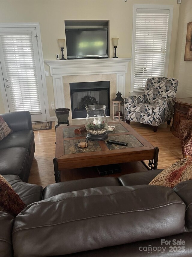 2300 Wednesbury Ct, Kannapolis, NC 28083 - living area with wood finished floors and a tile fireplace