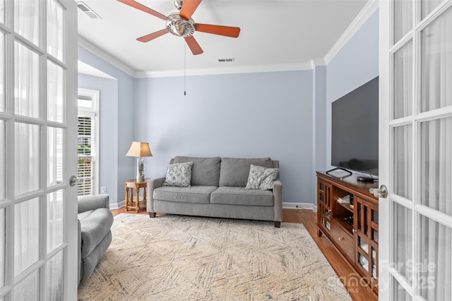 1624 Moonstone Dr, Matthews, NC 28105 - living room with crown molding, wood finished floors, a ceiling fan, and french doors