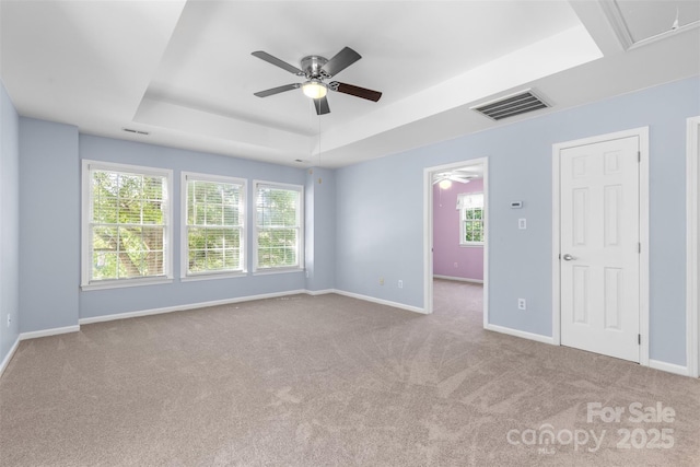 1624 Moonstone Dr, Matthews, NC 28105 - unfurnished bedroom featuring carpet floors, multiple windows, a raised ceiling, and attic access