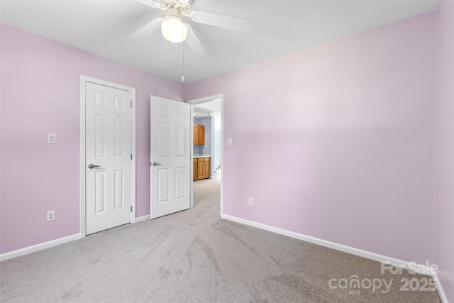 1624 Moonstone Dr, Matthews, NC 28105 - unfurnished bedroom with light colored carpet and ceiling fan