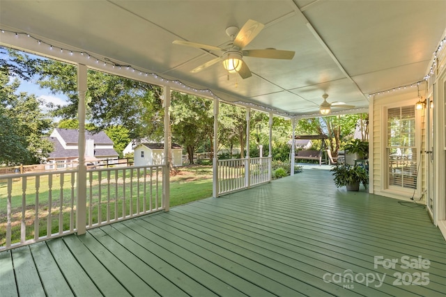 1624 Moonstone Dr, Matthews, NC 28105 - wooden terrace featuring a ceiling fan, a lawn, and a shed