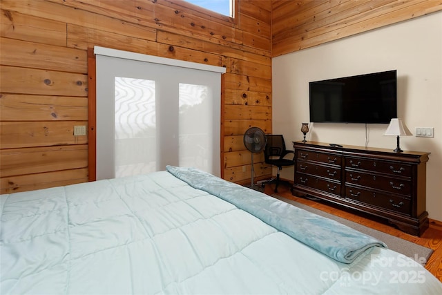 853 Granny Lewis Ln, Mars Hill, NC 28754 - bedroom featuring wood walls, wood finished floors, and a towering ceiling
