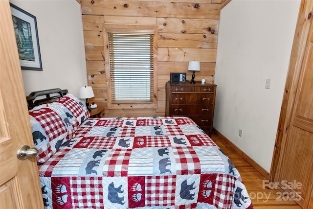 853 Granny Lewis Ln, Mars Hill, NC 28754 - bedroom featuring wood walls and wood finished floors