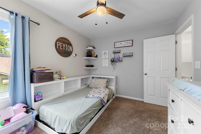 7425 Hubbard Woods Rd, Charlotte, NC 28269 - carpeted bedroom featuring a ceiling fan and baseboards
